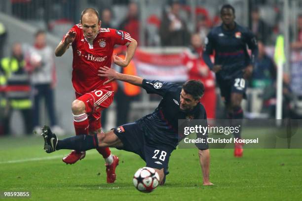 Arjen Robben of Bayern is challenged by Jeremy Toulalan of Lyon during the UEFA Champions League semi final first leg match between FC Bayern...