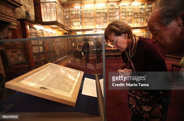Visitors look at one of the earliest original manuscripts of the Magna Carta from 1217 in an unexpected showcase of the extremely rare document at...