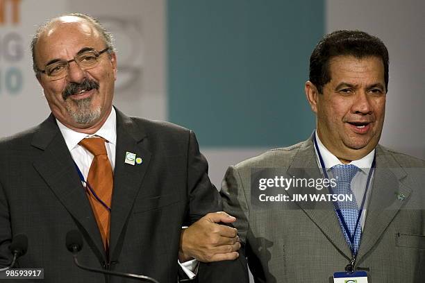 Argentina Labor Minister Carlos Tomada and Brazil Labor Minister Carlos Lupi speak during a press conference with other foriegn labor ministers at...