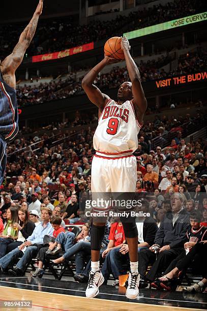 Luol Deng of the Chicago Bulls shoots the outside jump shot against the Charlotte Bobcats during the game at United Center on April 3, 2010 in...
