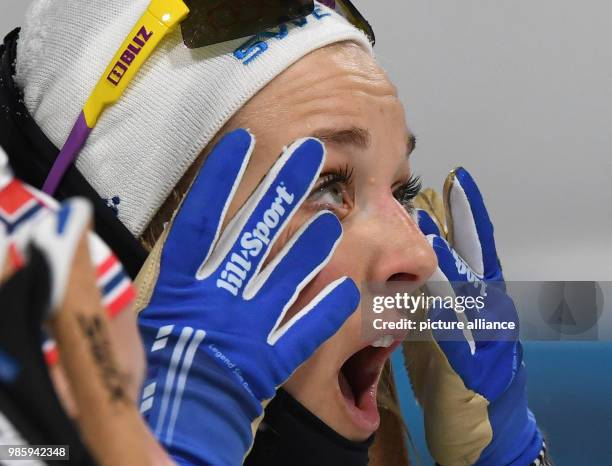 Dpatop - Sweden's Stina Nilsson celebrates after winning the women's cross-country skiing individual sprint classical on day four of the Pyeongchang...