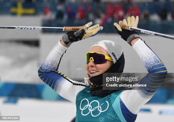 Sweden's Stina Nilsson celebrates after winning the women's cross-country skiing individual sprint classical on day four of the Pyeongchang 2018...