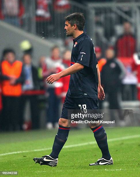 Jeremy Toulalan of Lyon leaves the pitch after receiving the Red Card during the UEFA Champions League semi final first leg match between FC Bayern...