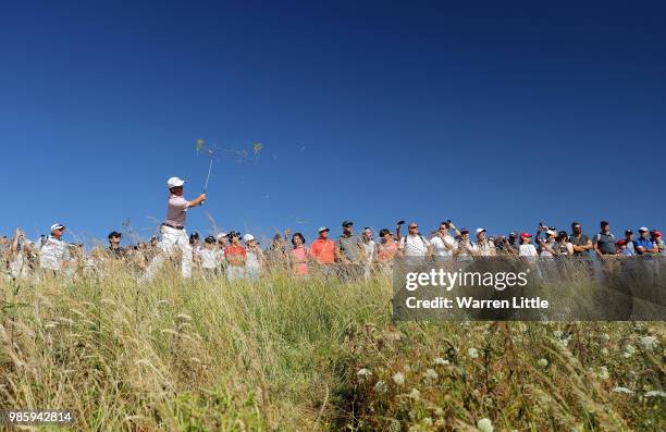 Justin Thomas of the USA plays his second shot on the 15th hole during the first round of the HNA Open de France at Le Golf National on June 28, 2018...