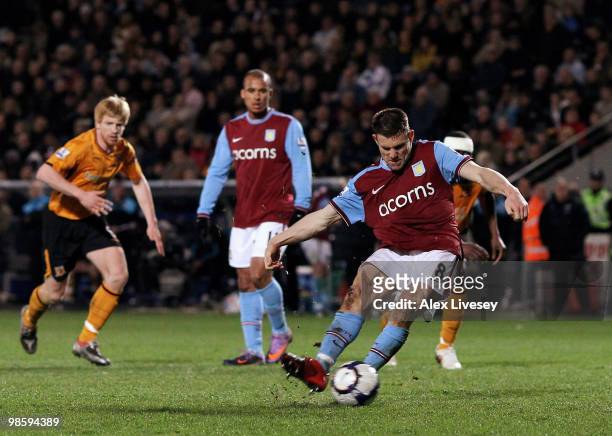 James Milner of Aston Villa scores the second goal from the penalty spot during the Barclays Premier League match between Hull City and Aston Villa...