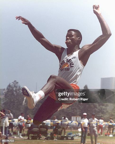 Carl Lewis competes in the long jump, circa 1980s.