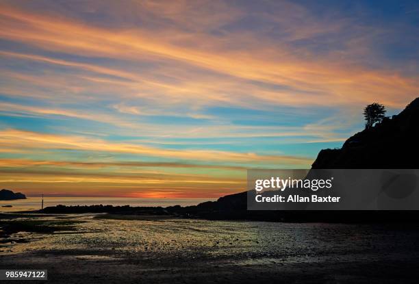 view of estuary in caostal town of combe martin at sunset - ilfracombe stock pictures, royalty-free photos & images