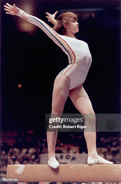 Nadia Comaneci of Romania competes on the balance beam in a gymnastics competition in 1977 in New York City.