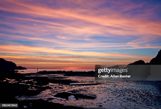 view of estuary in caostal town of combe martin at sunset - ilfracombe stock-fotos und bilder