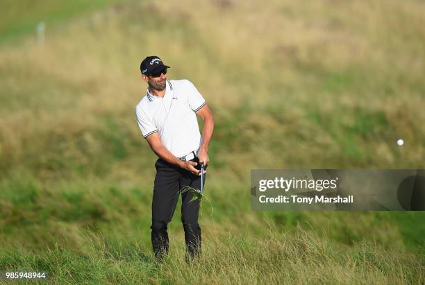 Alvaro Quiros of Spain plays his second shot out of the rough on the 10th fairway during Day One of the HNA Open de France at Le Golf National on...