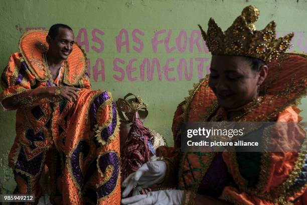 People in traditional Maracatu costumes prepare for their bgroup to attend the carnival parade in Nazare de Mata, Brazil, 13 February 2018. Nazare de...