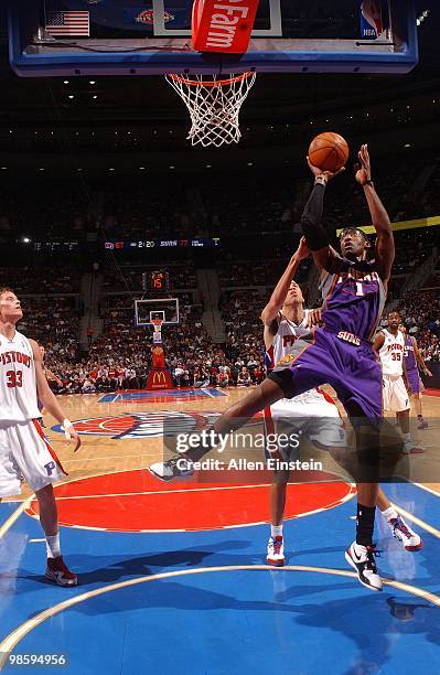 Amare Stoudemire of the Phoenix Suns goes up for a shot against Tayshaun Prince of the Detroit Pistons during the game at the Palace of Auburn Hills...
