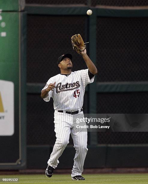 Left fielder Carlos Lee of the Houston Astros makes a catch against the Florida Marlins at Minute Maid Park on April 20, 2010 in Houston, Texas.