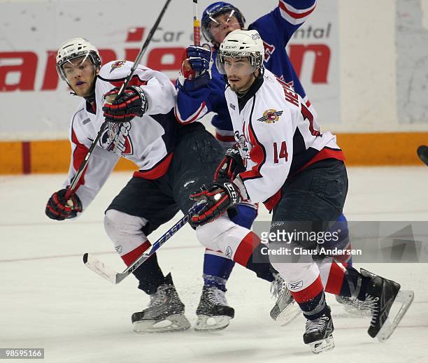 Adam Henrique and Taylor Hall of the Windsor Spitfires skate in Game Four of the Western Conference Final against the Kitchener Rangers on April 20,...