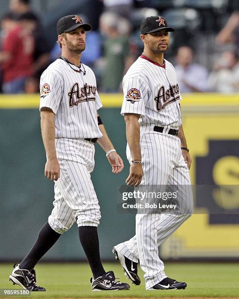 Jeff Keppinger, left, and Pedro Feliz of the Houston Astros walk on the field during pre-game warm ups against the Florida Marlins at Minute Maid...