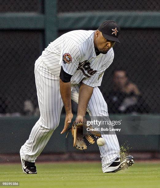 Left fielder Carlos Lee of the Houston Astros short hops a line drive against the Florida Marlins at Minute Maid Park on April 20, 2010 in Houston,...