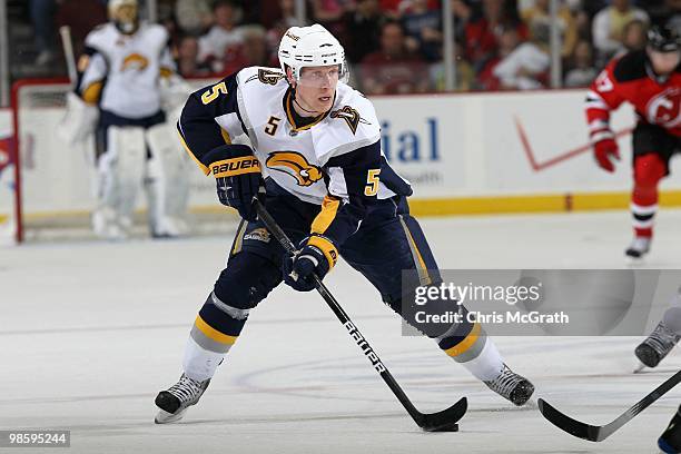 Toni Lydman of the Buffalo Sabres attacks against the New Jersey Devils at the Prudential Center on April 11, 2010 in Newark, New Jersey.