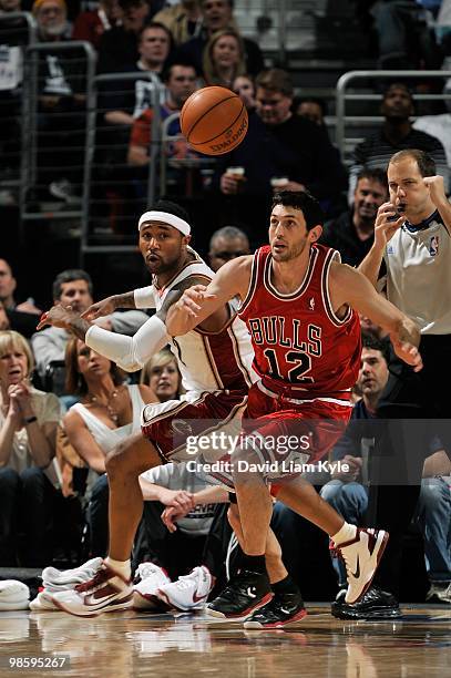 Kirk Hinrich of the Chicago Bulls and Mo Williams of the Cleveland Cavaliers go after a loose ball in Game One of the Eastern Conference...