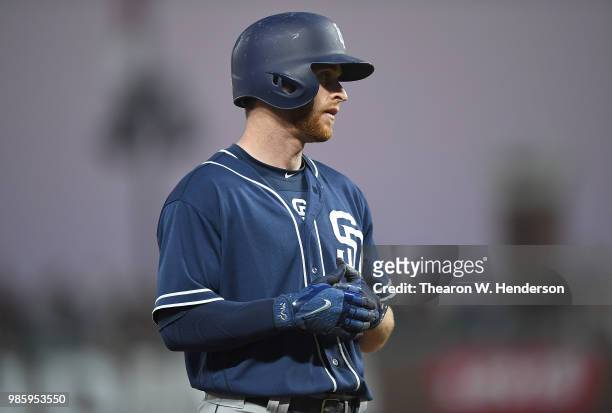 Cory Spangenberg of the San Diego Padres looks on while standing on third base against the San Francisco Giants in the top of the six inning at AT&T...