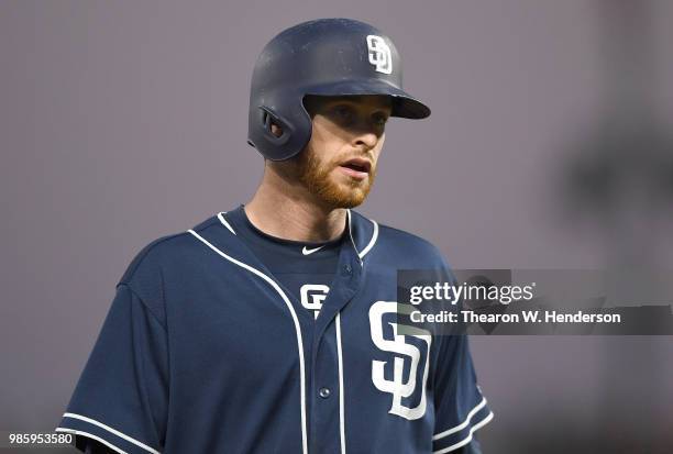 Cory Spangenberg of the San Diego Padres looks on while standing on third base against the San Francisco Giants in the top of the six inning at AT&T...