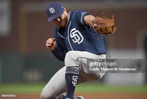 Cory Spangenberg of the San Diego Padres reacts to a ball hit down the line for a double off the bat of Gorkys Hernandez of the San Francisco Giants...