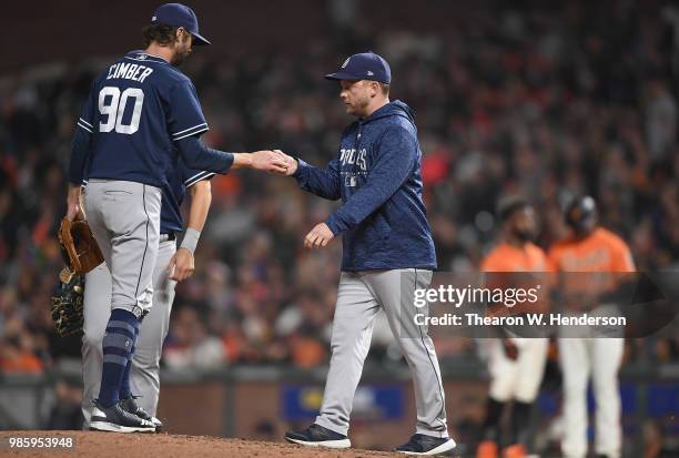 Manager Andy Green of the San Diego Padres takes the ball from Adam Cimber taking Cimber out of the game against the San Francisco Giants in the...