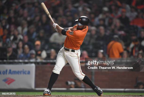 Brandon Belt of the San Francisco Giants bats against the San Diego Padres in the bottom of the seventh inning at AT&T Park on June 22, 2018 in San...