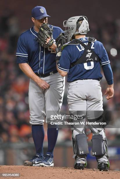 Catcher Raffy Lopez of the San Diego Padres comes out to the mound to have a conversation with pitcher Craig Stammen against the San Francisco Giants...