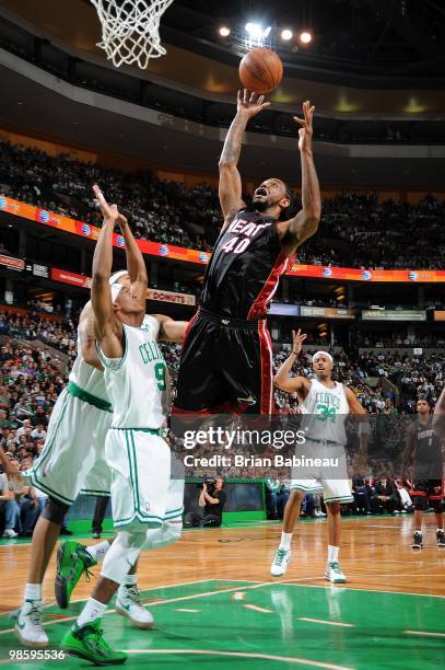 Udonis Haslem of the Miami Heat goes to the basket against Rajon Rondo of the Boston Celtics in Game One of the Eastern Conference Quarterfinals...