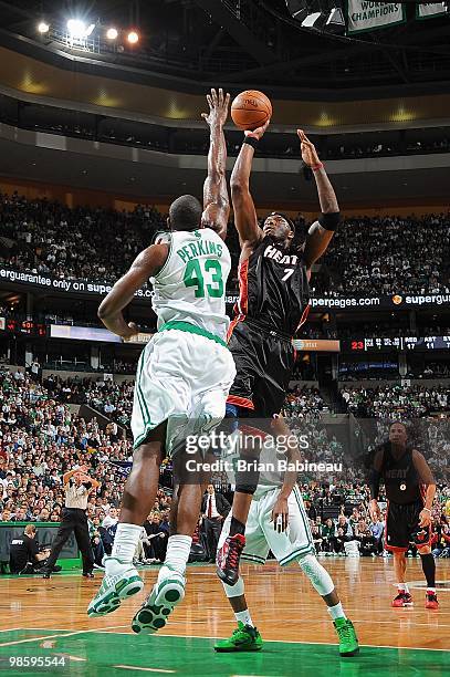 Jermaine O'Neal of the Miami Heat shoots against Kendrick Perkins of the Boston Celtics in Game One of the Eastern Conference Quarterfinals during...