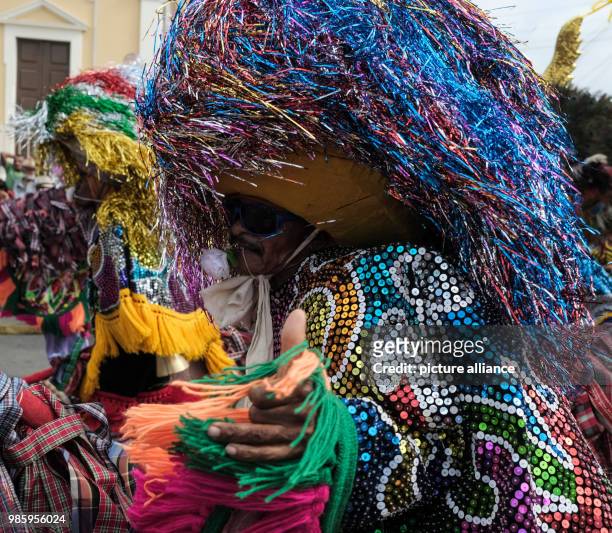 Man dressed in traditional carnival costume taking part in a carnival parade in Nazare de Mata, Brazil, 13 February 2018. Nazare de mata is a small...