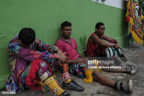 Members of a Maracatu group taking a break after a carnival parade in Nazare de Mata, Brazil, 13 February 2018. Nazare de mata is a small city in...