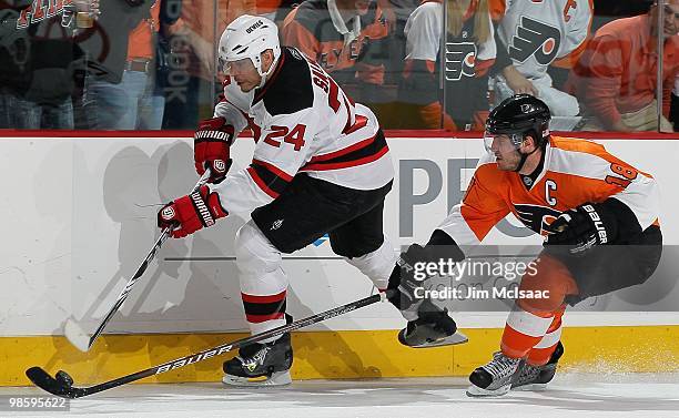 Bryce Salvador of the New Jersey Devils skates against Mike Richards of the Philadelphia Flyers in Game Four of the Eastern Conference Quarterfinals...