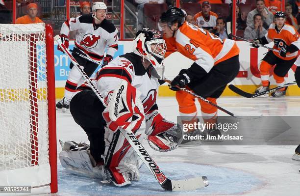 Martin Brodeur of the New Jersey Devils defends against the Philadelphia Flyers in Game Four of the Eastern Conference Quarterfinals during the 2010...