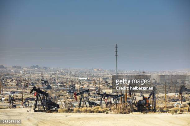 forest of nodding donkeys in kern river oilfield - kern river oil field stock pictures, royalty-free photos & images