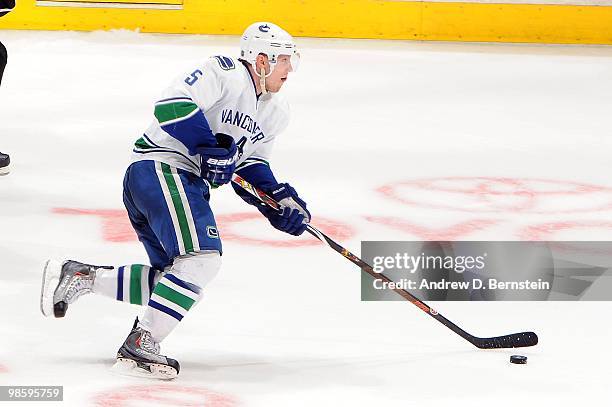 Christian Ehrhoff of the Vancouver Canucks skates with the puck against the Los Angeles Kings in Game Three of the Western Conference Quarterfinals...