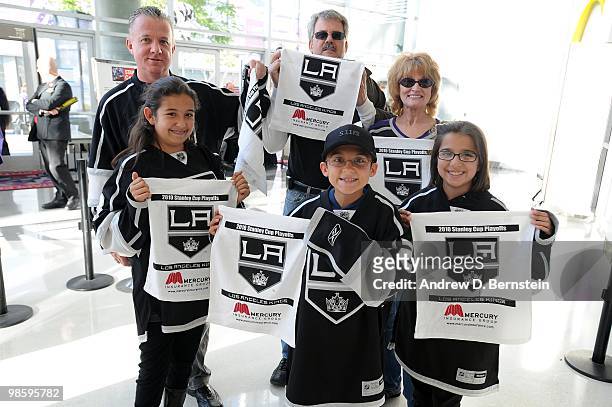 Fans of the Los Angeles Kings hold up towels prior to taking on the Vancouver Canucks in Game Three of the Western Conference Quarterfinals during...