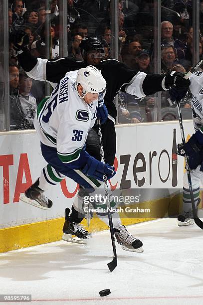 Wayne Simmonds of the Los Angeles Kings collides with Jannik Hansen of the Vancouver Canucks in Game Three of the Western Conference Quarterfinals...