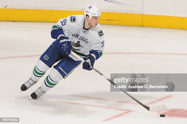 Shane O'Brien of the Vancouver Canucks skates with the puck against the Los Angeles Kings in Game Three of the Western Conference Quarterfinals...