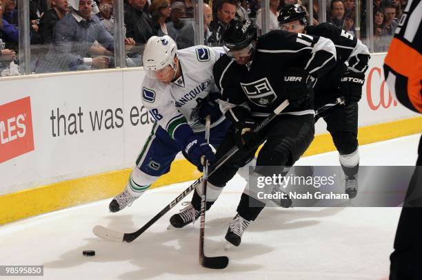 Wayne Simmonds of the Los Angeles Kings battles for the puck against Steve Bernier of the Vancouver Canucks in Game Three of the Western Conference...