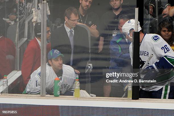 Roberto Luongo of the Vancouver Canucks sits on the bench after being pulled in the second period against the Los Angeles Kings in Game Three of the...
