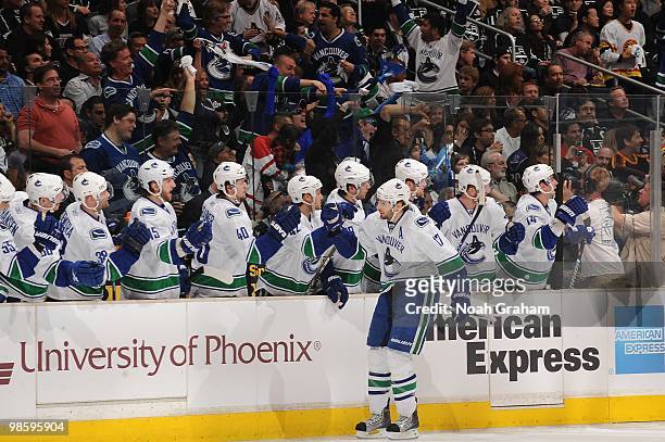 Ryan Kesler of the Vancouver Canucks celebrates with the bench after a goal against the Los Angeles Kings in Game Three of the Western Conference...