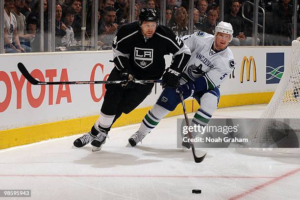 Alexander Frolov of the Los Angeles Kings battles for the puck against Shane O'Brien of the Vancouver Canucks in Game Three of the Western Conference...