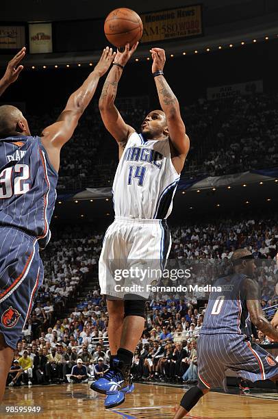 Jameer Nelson of the Orlando Magic shoots a jump shot against Boris Diaw of the Charlotte Bobcats in Game One of the Eastern Conference Quarterfinals...