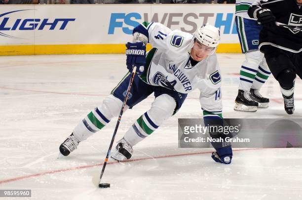 Alexandre Burrows of the Vancouver Canucks skates with the puck against the Los Angeles Kings in Game Three of the Western Conference Quarterfinals...