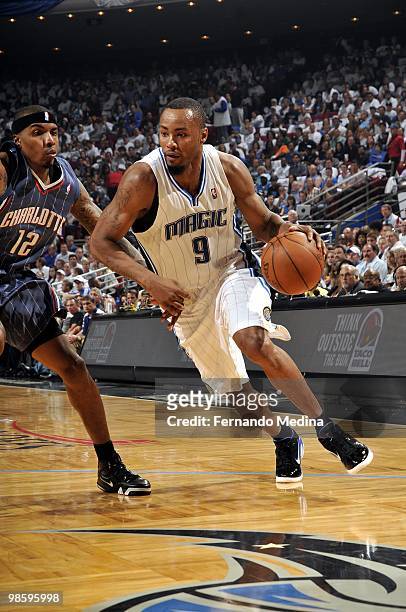 Rashard Lewis of the Orlando Magic drives to the basket against Tyrus Thomas of the Charlotte Bobcats in Game One of the Eastern Conference...