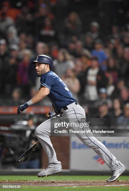 Eric Hosmer of the San Diego Padres hits a bases loaded two-run rbi single against the San Francisco Giants in the top of the ninth inning at AT&T...