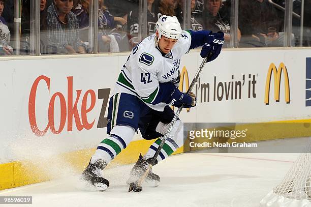 Kyle Wellwood of the Vancouver Canucks skates with the puck against the Los Angeles Kings in Game Three of the Western Conference Quarterfinals...