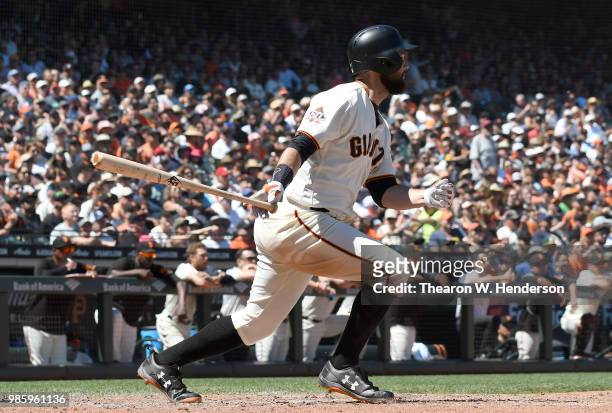 Brandon Belt of the San Francisco Giants bats against the San Diego Padres in the bottom of the seventh inning at AT&T Park on June 23, 2018 in San...