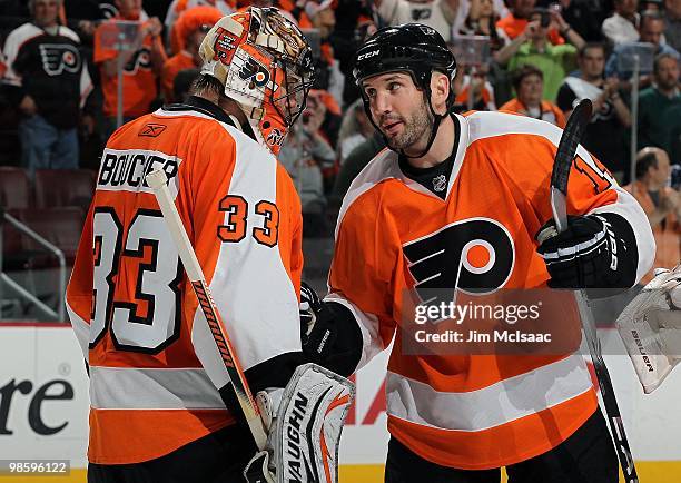 Brian Boucher and Ian Laperriere of the Philadelphia Flyers celebrate after defeating the New Jersey Devils in Game Four of the Eastern Conference...